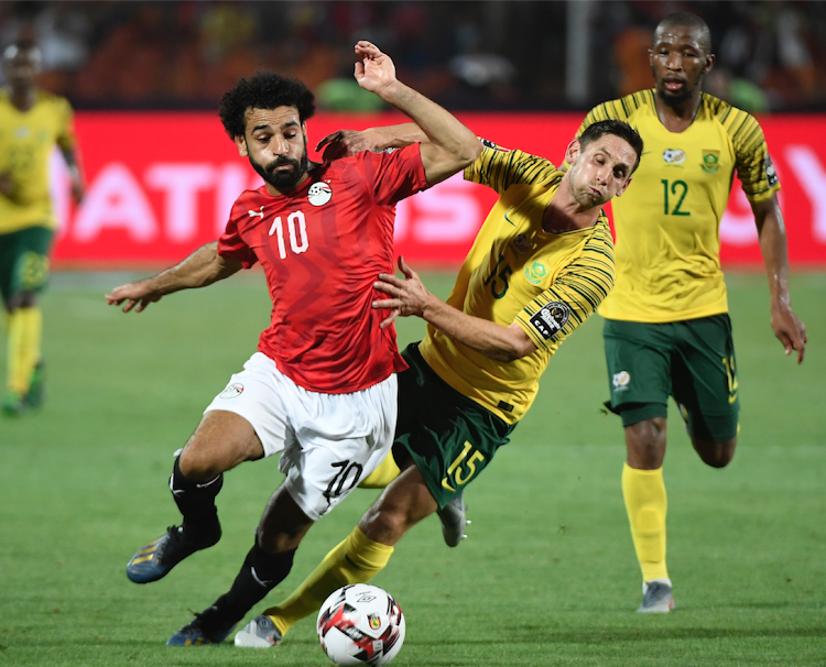 Egypt forward Mohamed Salah in action with Africa midfielder Dean Furman during the 2019 Africa Cup of Nations