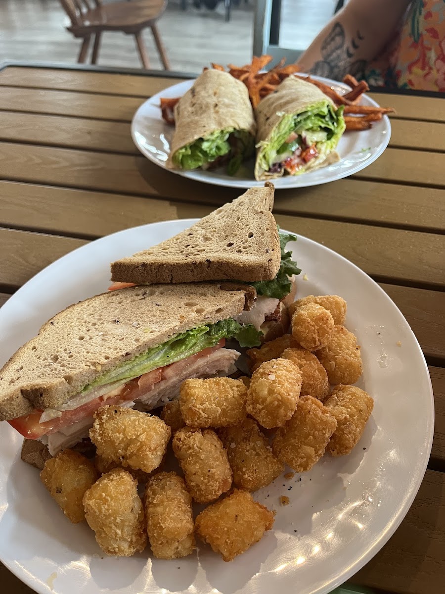 Turkey club with tots, and a veggie wrap with sweet potato fries.