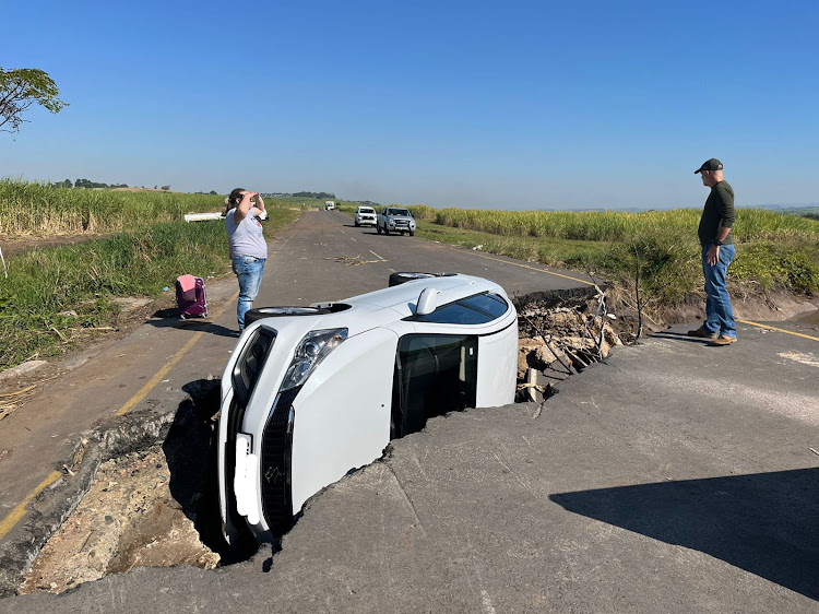 A hired vehicle driven by a woman who was not familiar with the food-damaged R102 landed on its side in a hole in the road on Friday.