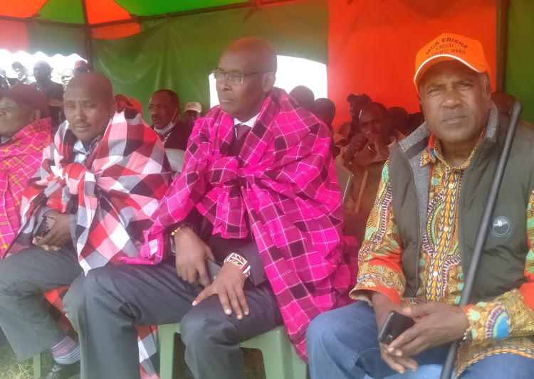 Narok North MP Moitalel ole Kenta|(centre) when he distributes cheques worth Sh 42 million for school infrastructure at Olorupa Primary School in Narok North constituency.