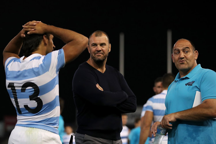 Argentina coach Mario Ledesma talks to Pumas coaching consultant Michael Cheika and Matias Orlando of the Pumas following the 2020 Tri-Nations match between the Australian Wallabies and the Argentina Pumas at McDonald Jones Stadium on November 21, 2020 in Newcastle, Australia.