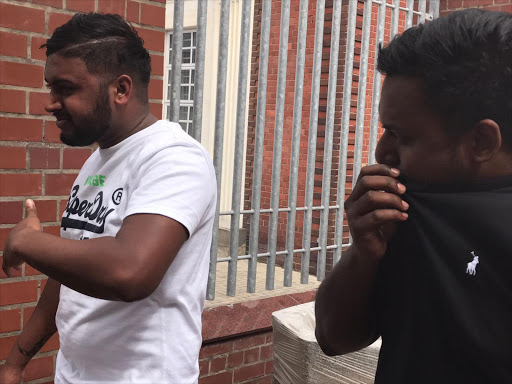 Brothers Demane and Sebastian Pillay leave the Port Elizabeth Magistrate's Court on Tuesday after being released on bail of R500