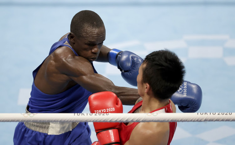 Kenya's Nicholas Okoth in action against Erdenebat Tsendbaatar of Mongolia