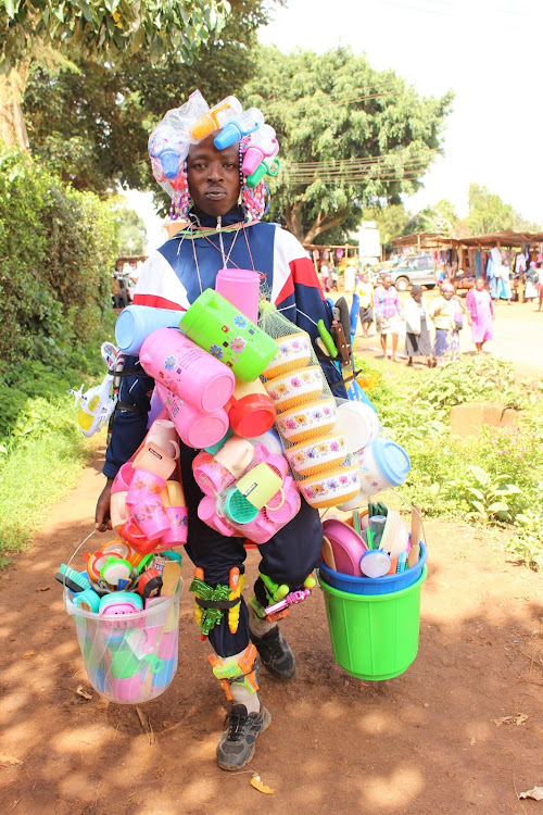 Mickson Githogori hawks his plastic wares in Nyeri town