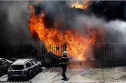 Firefighters battle a blaze at a chemical factory in New Germany, west of Durban, after an explosion on Tuesday. 