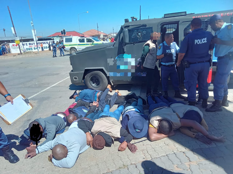 Thirteen people were arrested after the shoot-out was halted by the arrival of West Rand police.