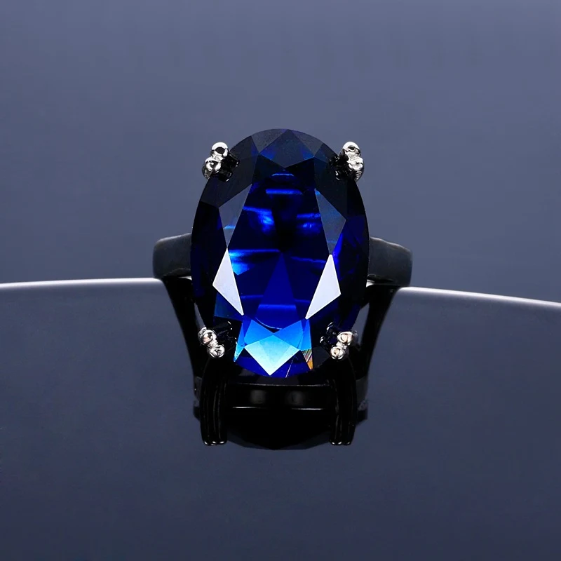 Bague haute couture ovale avec diamant artificiel à quatre griffes, pour un style élégant et une brillance exceptionnelle.