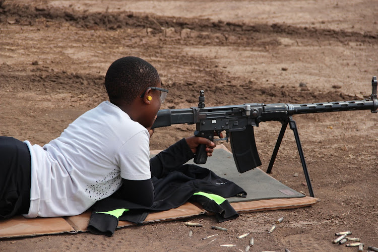 Young shooter Ayub Mugo in action during the KSSF Open Day Jamhuri Shoot at Kwenia Range in Magadi