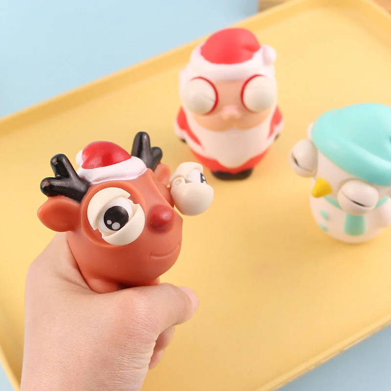 Jouet de Noël anti-stress avec yeux globuleux et design mignon. Idéal pour la décompression et l'amusement. Cadeau parfait pour les enfants.