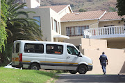 An officer stands guard outside speaker Nosiviwe Mapisa-Nqakula's home in Bruma.