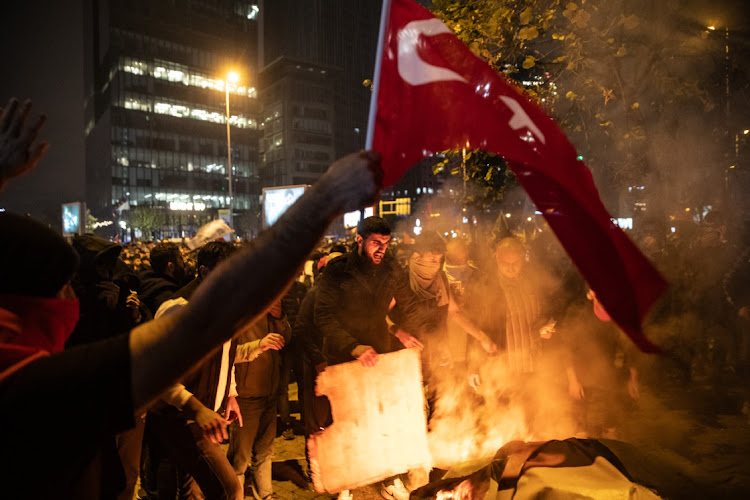 Protesters demonstrate in front of the Israeli consulate after an explosion at hospital in Gaza killed hundreds on October 17, 2023 in Istanbul, Turkey.