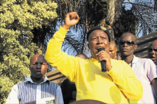 HOME GROUND: Julius Malema addresses his supporters at his house in Flora Park, Polokwane, at the weekend.