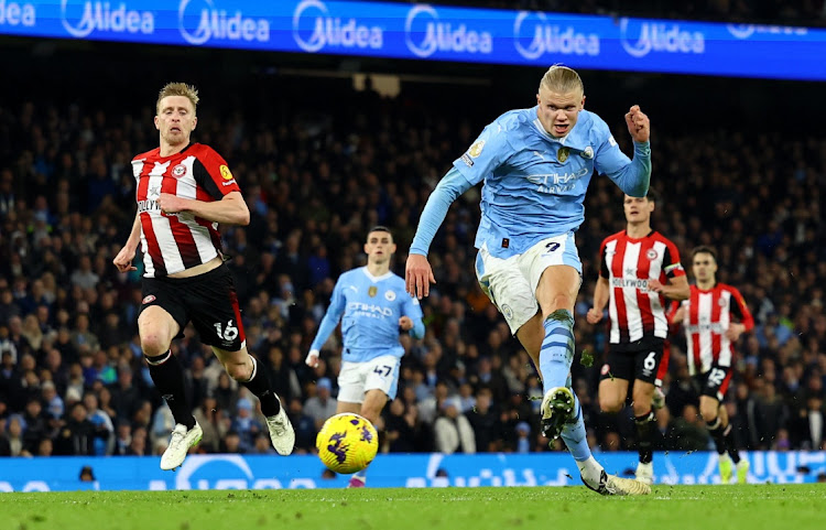 Erling Haaland scores Manchester City's goal in their Premier League match against Brentford at Etihad Stadium in Manchester on Tuesday night.