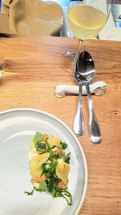 Farm Spirit, an all vegan restaurant, Potato with preserved local lemon citrus, onion cream, fermented seed mustard and mustard greens, potato chips, tangerine sage