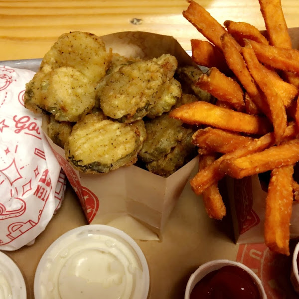 Gluten free burger, fried pickles and sweet potato fries