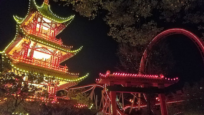 The Japanese pagoda and The Demon roller coaster / Visiting Tivoli Amusement park during Halloween decoration time, October 2018