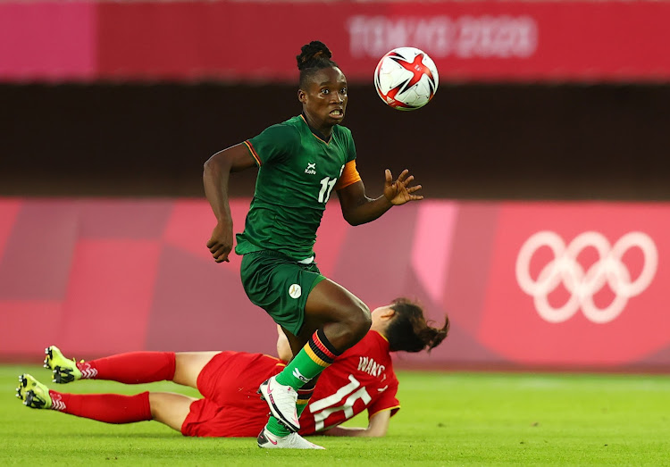 Barbara Banda of Zambia in action with Wang Xiaoxue of China