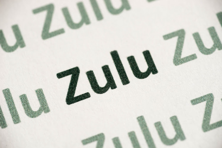 Word Zulu language printed on white paper macro