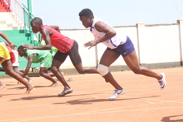 Beautrice Anyango (R) takes off in the women's 100m race