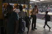 People drink tea at the Dadar railway station during a lockdown in Mumbai, India, on Saturday, April 10, 2021. Maharashtra has halted all non-essential services, ordered private companies to work from home, and shut malls and restaurants through April. 