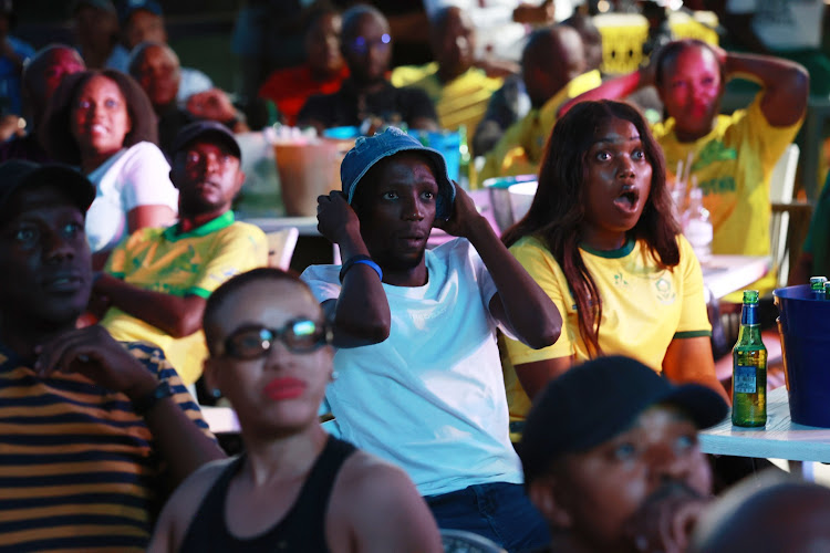 Fans watching Bafana Bafana and Nigeria at Disoufeng Pub Meadowlands Zone 10, Soweto.