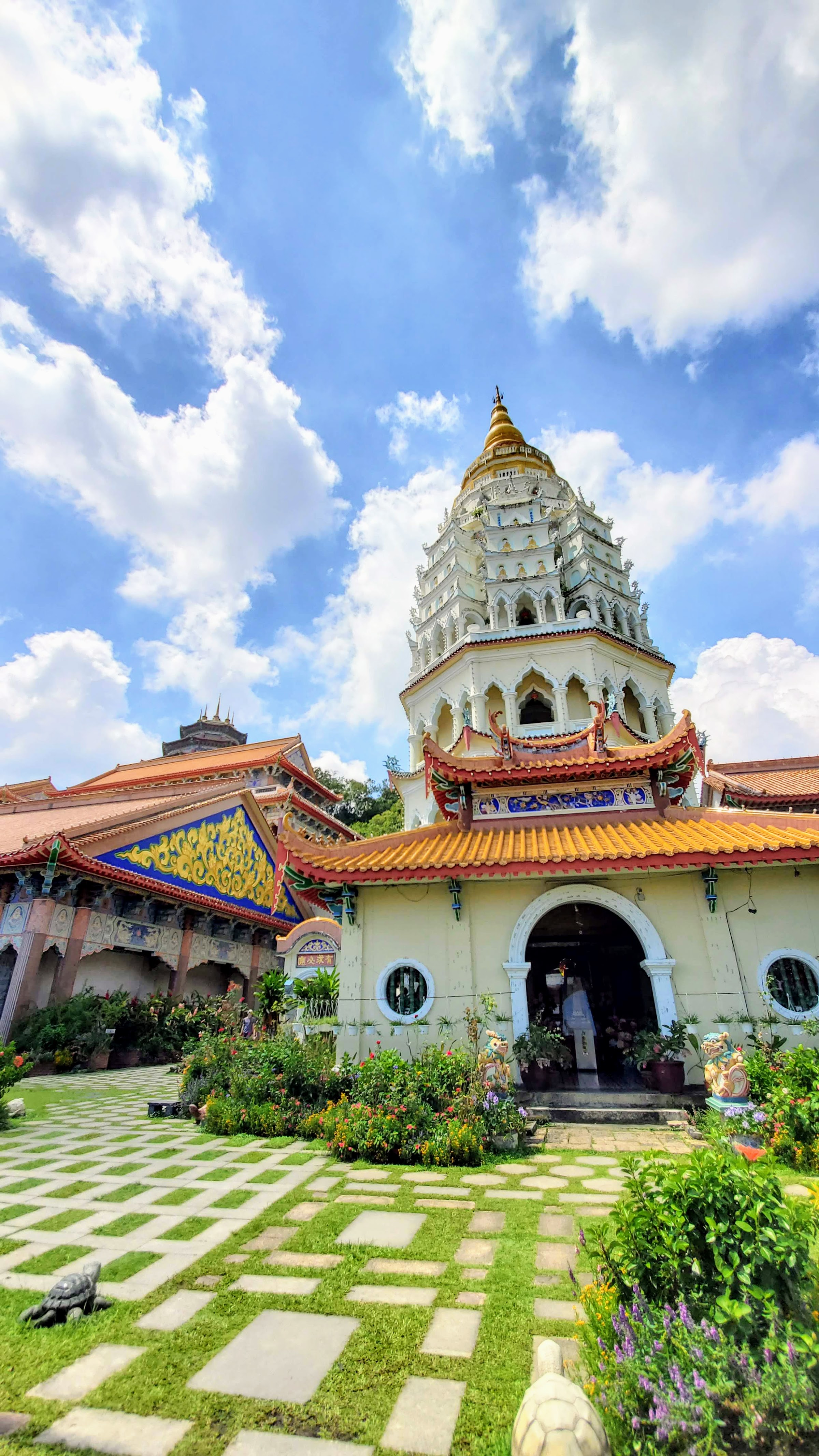 Visiting Kek Lok Si: What makes it unique is that among its millions of Buddhas it shows the blending of cultures that is so representative of Malaysia by including many stylistic representations of Buddha.