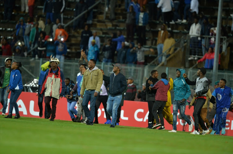 Fans invading the pitch during the CAF Confederation Cup Final, 2nd Leg match between SuperSport United and TP Mazembe at Lucas Moripe Stadium on November 25.