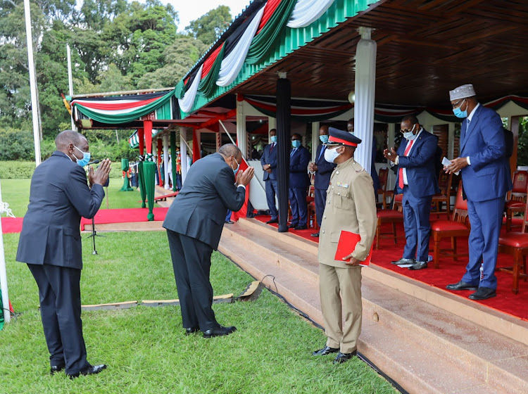 President Uhuru Kenyatta and Deputy President William Ruto greet a section of the leaders who graced the 57th Madaraka Day Celebrations at State House Gardens, Nairobi.