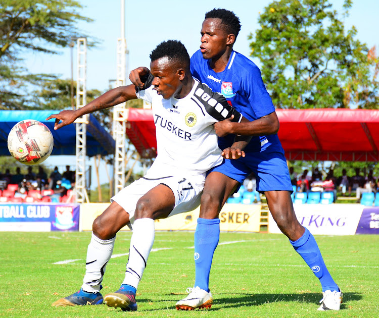 Tusker's Chrispinus Onyango (L) shields the ball from Joshua Nyatini of Posta Rangers during their Premier League clash at Moi, Kasarani Annex.