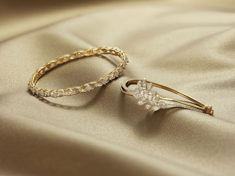 Golden Magnificence collection: 18ct yellow gold and diamond bangles.