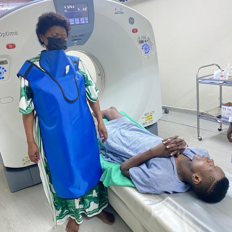 Jose Chameleone with his mother at the hospital