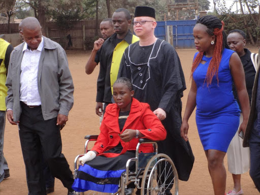 Sharon Makungu (on wheelchair) with her parents Elias Ndune and Jacqueline Ndune and ODM nominated MP for special interest groups at Matopeni Primary school in Ruiru. The parents want the Rift Valley Railway Company to compensate their daughter after she lost her limbs after being ran over by a train.