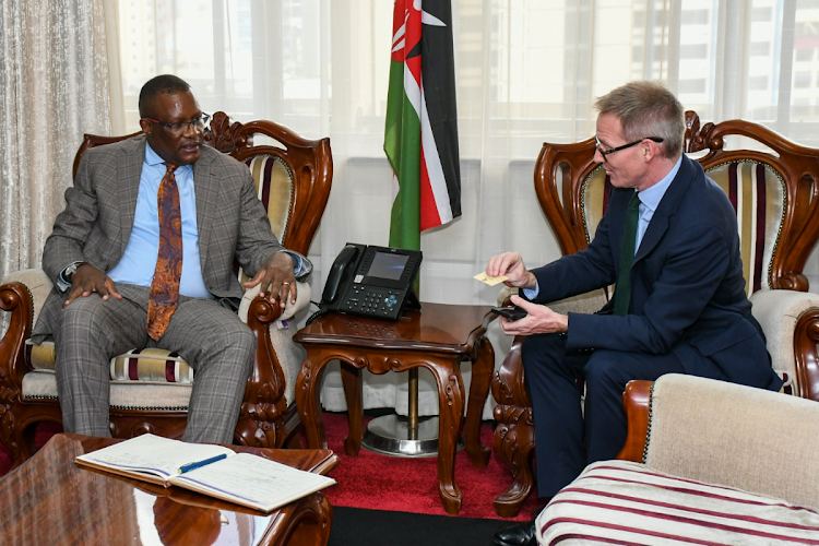 Cabinet Secretary for Information, Communications and Digital Economy, Eliud Owalo with UK Ambassador to Kenya, Neil Wigan during a formal meeting on May 20, 2024.