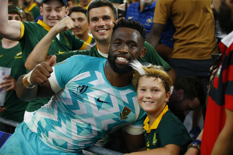 Siya Kolisi poses for a picture with a young Springbok fan after South Africa's opening Rugby World Cup pool B win against Scotland at Stade Velodrome in Marseille on Sunday.