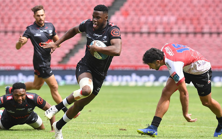 Aphelele Fassi of the Sharks cuts the Lions defence and scores a try in the United Rugby Championship match at Ellis Park on January 22 2022.