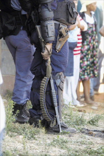 READY: Members of the police during the service delivery protest at Thembelihle in Lenasia, south of Johannesburg. PHOTO: ANTONIO MUCHAVE