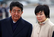 Japan's Prime Minister Shinzo Abe (L) with his wife Akie. 