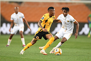 Kaizer Chiefs forward Pule Mmodi (left) and Royal AM's Jabulani Ncobeni during the DStv Premiership match at FNB Stadium on September 16 2023.