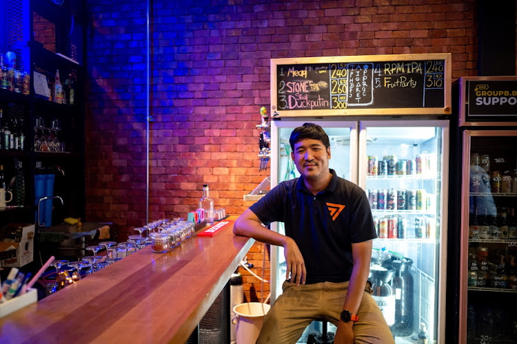 Taopiphop Limjitrikorn from the Move Forward Party poses at his bar in Bangkok, Thailand, on May 23 2023. Picture: REUTERS/ATHIT PERAWONGMETHA