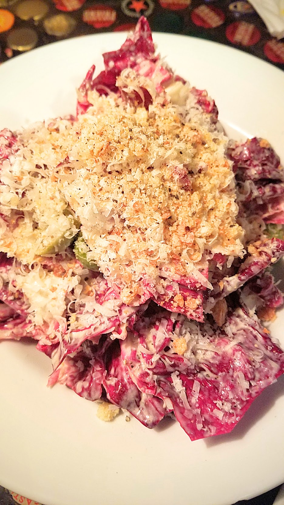 Example Food at Saraveza Radicchio salad with sherry dressing, Parmesan, olive, and breadcrumb