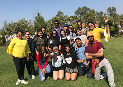 The Zyla team pose in daylight at a park.