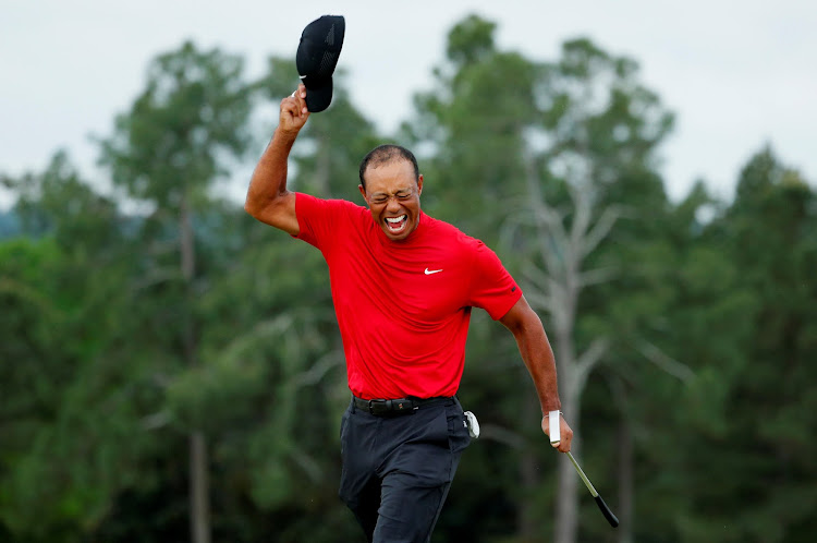 Tiger Woods of the U.S. celebrates on the 18th hole after winning the 2019 Masters.