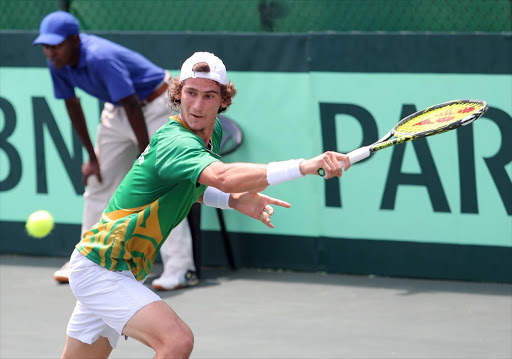 Lloyd Harris of South Africa in action against Vladimir Ivanov during the opening singles of the Davis Cup tie between South Africa and Estonia at the Irene Country Club on February 03, 2017 in Pretoria, South Africa. Picture Credit: Reg Caldecott/Gallo Images)