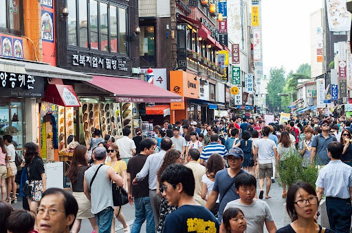 Tourists and shoppers line the sidestreets of Insadong in Seoul, South Korea