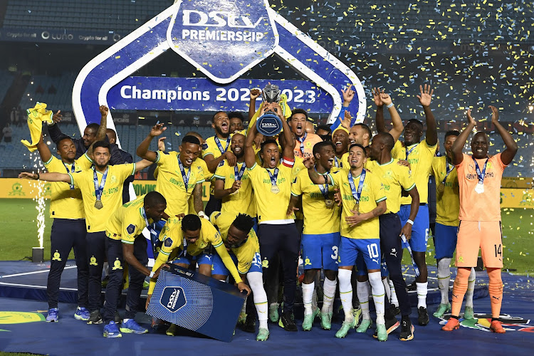 Mamelodi Sundowns players celebrate with the DSyv Premiership trophy after the 1-1 draw with Maritzburg United at Loftus Versfeld Stadium on May 16 2023 in Pretoria.