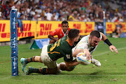 Andrew Smith of Ireland scores a try during the 2023 Sydney Sevens match between South Africa and Ireland at Allianz Stadium on January 28, 2023 in Sydney, Australia.