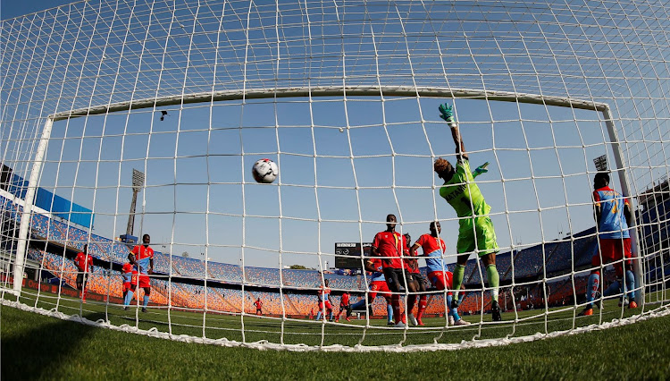 Uganda's Patrick Kaddu scores their first goal.