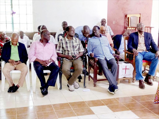 Jubilee Party Secretary General Raphael Tuju, ODM leader Raila Odinga, and President Uhuru Kenyatta's brother, Muhoho Kenyatta at St Peter's Nyamira church yesterday. /LAMECK BARAZA