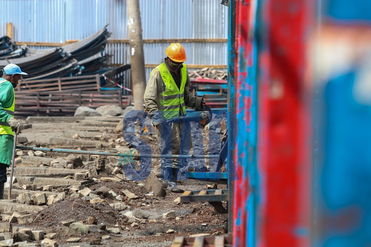 Workers at Muthurwa Bus terminus on March 29, 2022. The ongoing facelifting is managed by the NMS to help improve and improve traffic in the city.