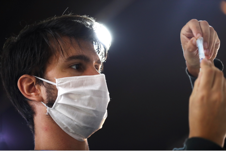 A health worker prepares a dose of the Sputnik V (Gam-COVID-Vac) vaccine against the coronavirus disease at the Tecnopolis Park, in Buenos Aires, Argentina on April 15 2021.